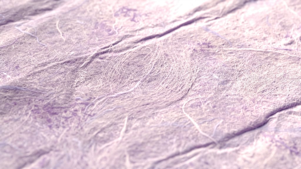 Abstract macro texture of handmade lilac paper with long visible fibers and soft gentle folds under diffuse morning ligh